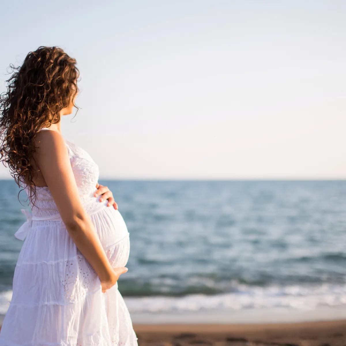 Pregnant woman by the sea